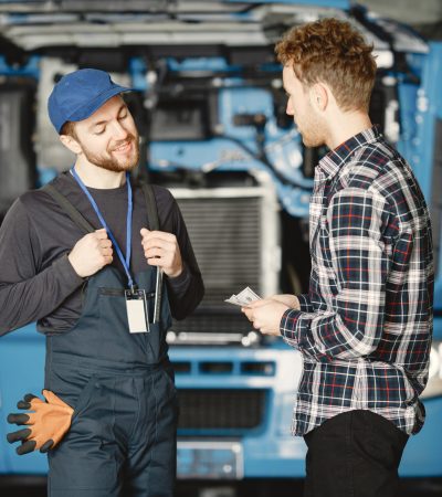 Two workers in uniform. Workers with tools. Working day.