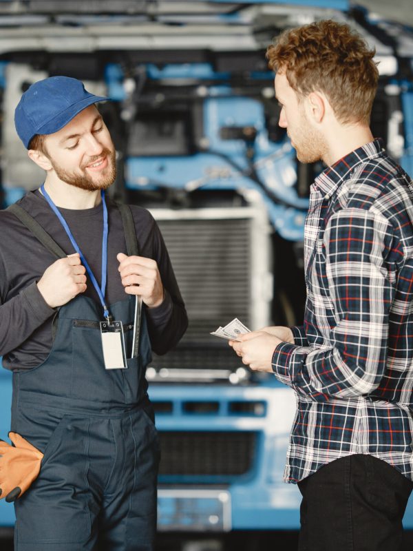 Two workers in uniform. Workers with tools. Working day.